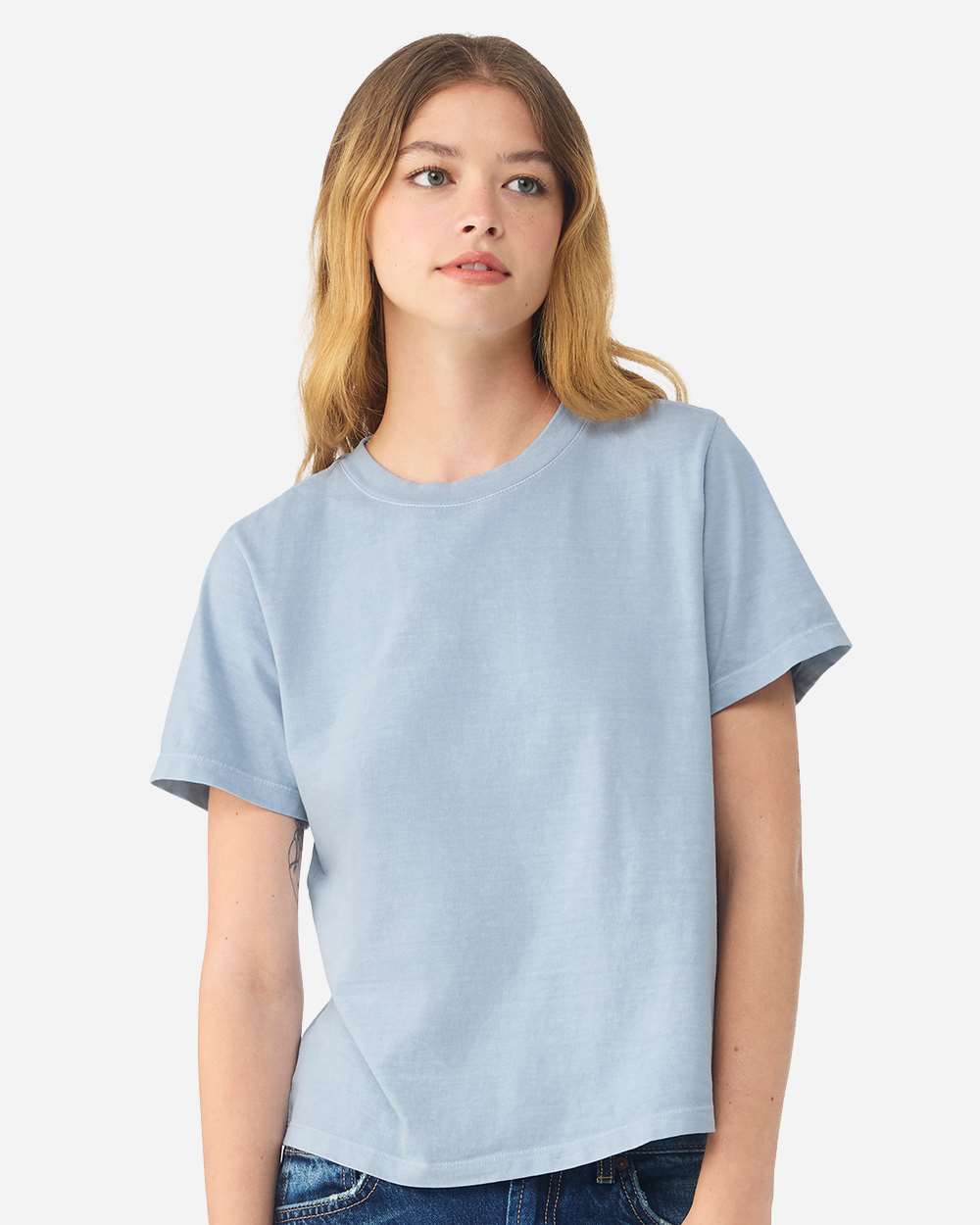 BELLA+CANVAS Women's Heavyweight Garment-Dyed Tee BC6110GD in Light Washed Denim, front view on model